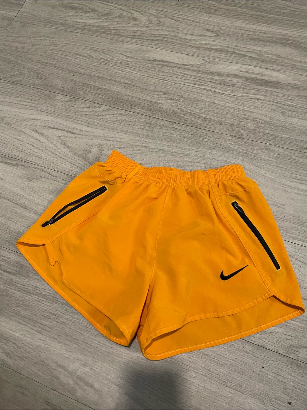 Nike Women's Bright Orange Athletic Shorts with Black Zippers